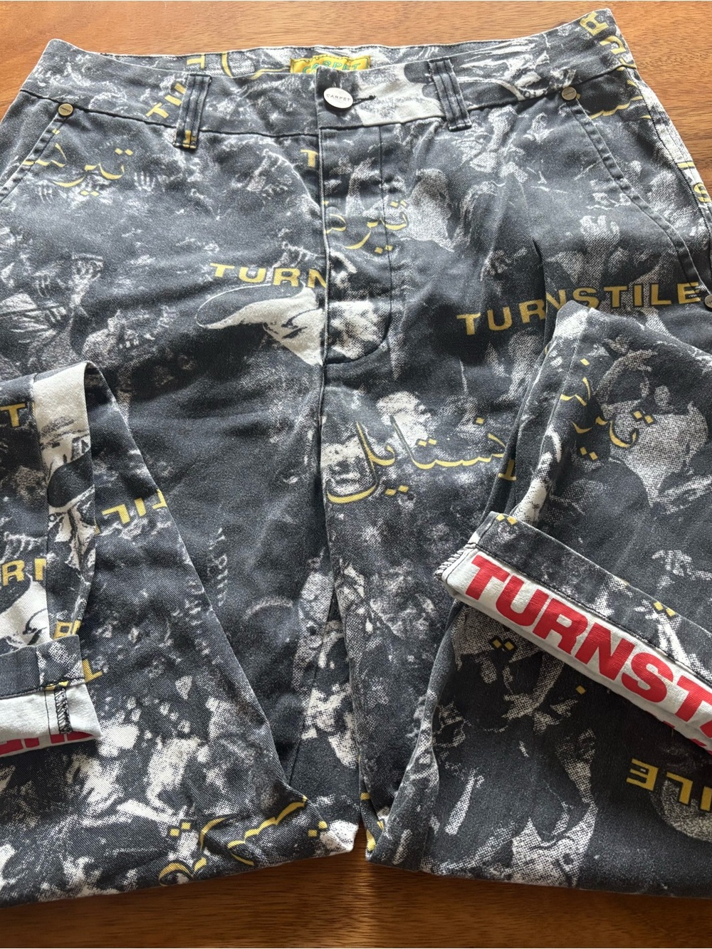 Carpet x TURNSTILE Graphic Print Jeans in Black and Yellow